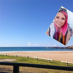 Selfie of a girl with pink hair relaxing on a beach