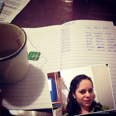 Attractive young girl takes selfie while studying