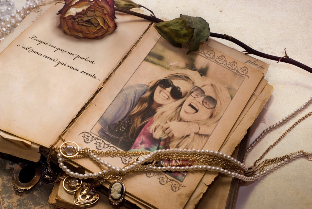 Vintage photo frame is added to a photo of two girls