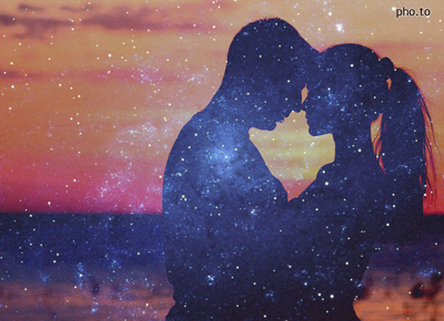 A double exposure photo with starry night sky and silhouette photo of a loving couple