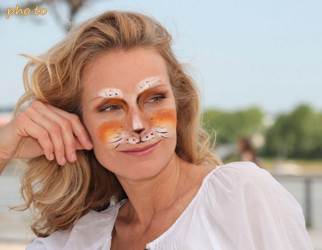 The cat make up photo effect was added to a photo of a beautiful blonde woman