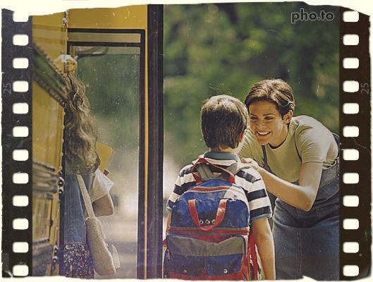 Mother taking her son to school