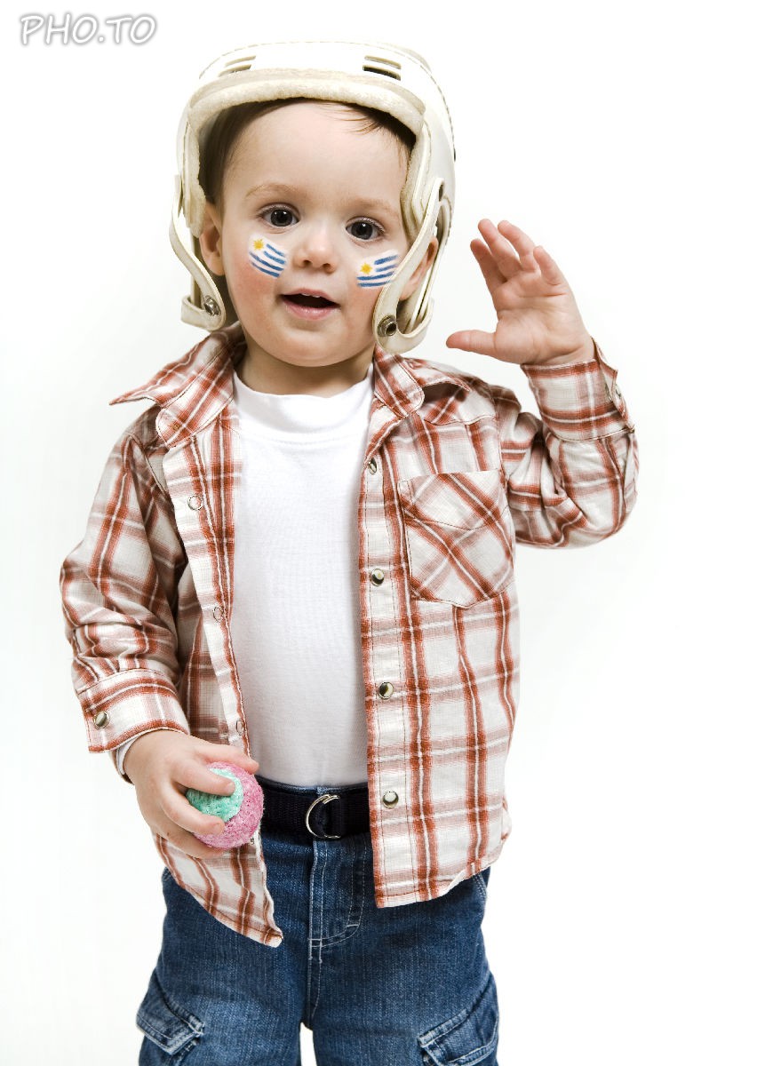 A virtual face paint with a flag of Uruguai was applied to a photo of a little boy - sport fan