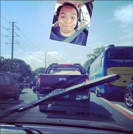 A young man is waiting until traffic jam disappears