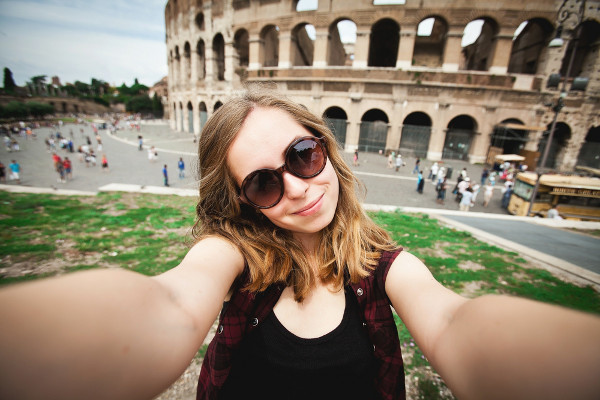 A selfie of a young girl with deep background