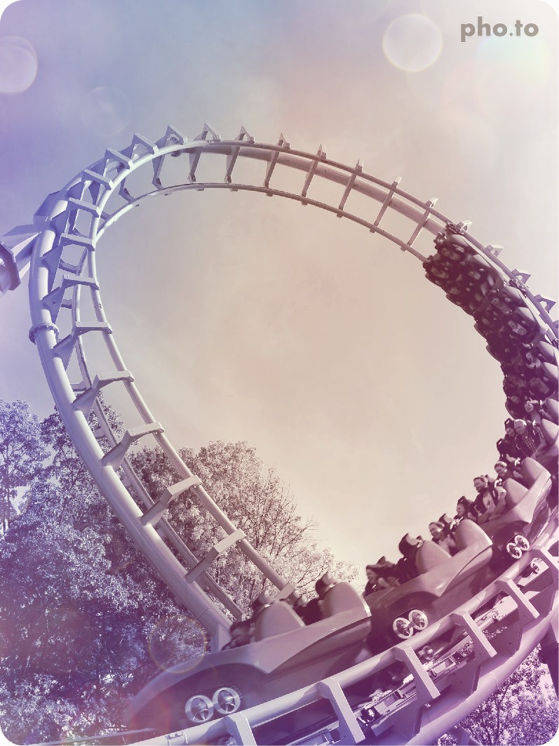 A photo of roller coaster edited with a color filter to accentuate its atmospheric mood