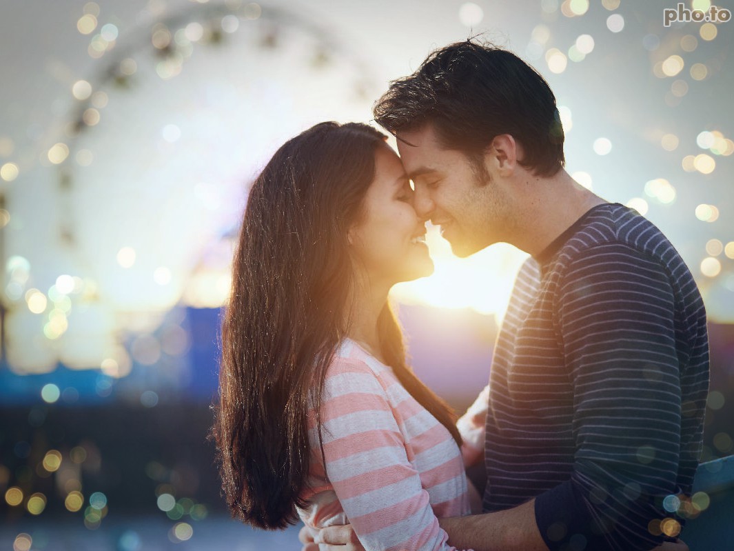 A photo of loving couple edited with mobile app to add bokeh effect