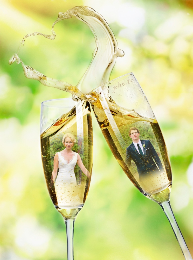 Bride and groom reflected in champagne glasses