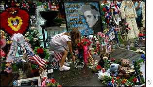 Flowers swamp Elvis' grave 