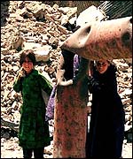 Children near ruins in Kabul