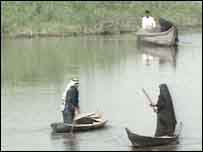 Marsh Arabs in their customary high-prowed canoes