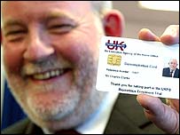 Home Secretary Charles Clarke with an identity card