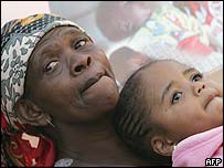 A girl orphaned by Aids with her grandmother in South Africa