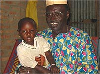 Ali Farka Toure and his youngest daughter at his home in Niafunke