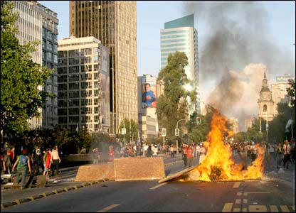 Fire burns in Santiago after clashes between police and Pinochet supporters (Pic: Neil Walker)