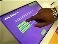 A man searching on a Jobpoint computer terminal 