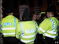 Police officers and protesters