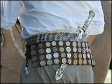 An Argentine man with a belt of coins. Archive photo