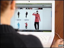 A woman looks at a website selling 'burkinis'