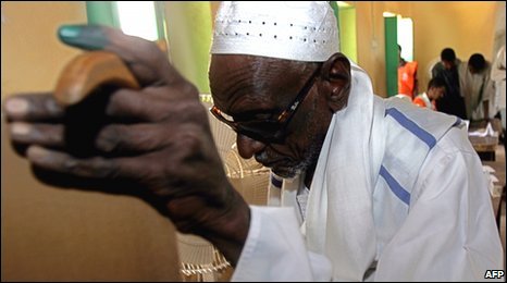 A man votes in al-Kamlin, 150 kms south of the capital Khartoum, on Thursday