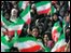 People waving flags at the rally in Tehran