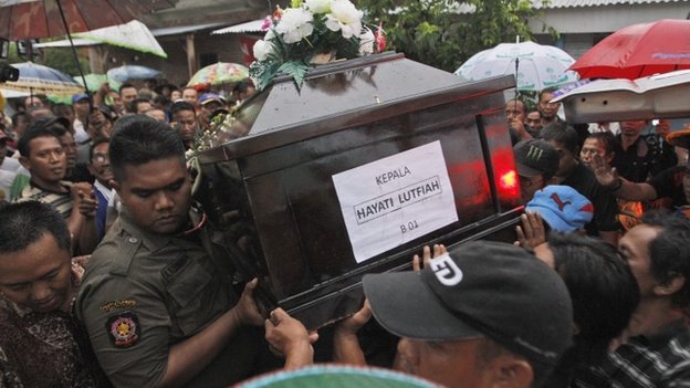 The funeral of Air Asia crash victim, Hayati Lutfiah Hamid, Surabaya, east Java, 1 January 2015