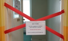 Red tape forms an X to block an entrance with a sign headlined 'Raac ceiling'.