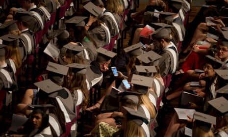 Young graduates in gowns and mortarboards at the University of York, England.