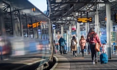 People boarding a train bound for London