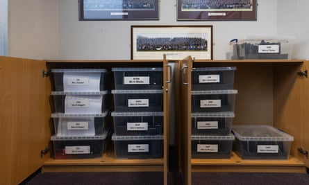 boxes of mobile phones in a cabinet