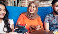 Woman making a contactless payment