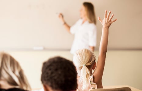 Teacher teaching children in classroom