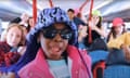 The kids of the Kabin Crew and the Lisdoonvarna Crew in brightly coloured clothes and hats posing on a bus