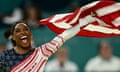 Simone Biles celebrates with a US flag during the Paris 2024 Olympics