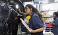 Young female engineers working with helicopters