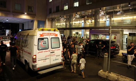 People gather outside a hospital in Beirut after thousands are injured at more than 10 people killed in pager explosions.