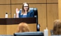 A woman is sworn in at a hearing.