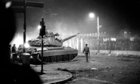 Army tanks prepare to drive through the gates of the student-occupied Polytechnic Institute in Athens on 17 November, 1973. In 1974, Greece's military regime collapsed and democracy was restored.  