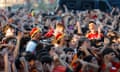 A crowd of boisterous Spain fans wearing the team's merchandise