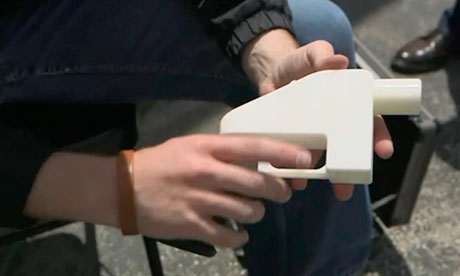 Screengrab of Cody Wilson holding a gun made by 3D printer in Austin, Texas