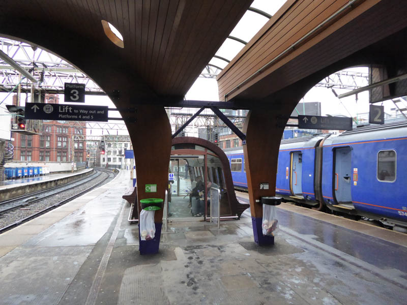 Beyond the wooden canopy is a small woden shelter on platforms 2 and 3